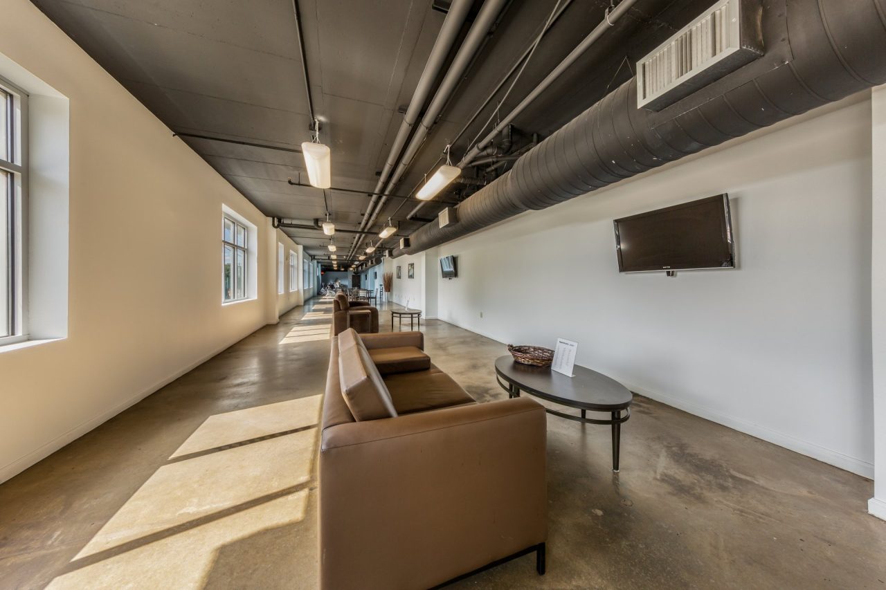 24-longview-apartments-near-university-of-texas-at-austin-leasing-office-and-residents-center-lounge-seating