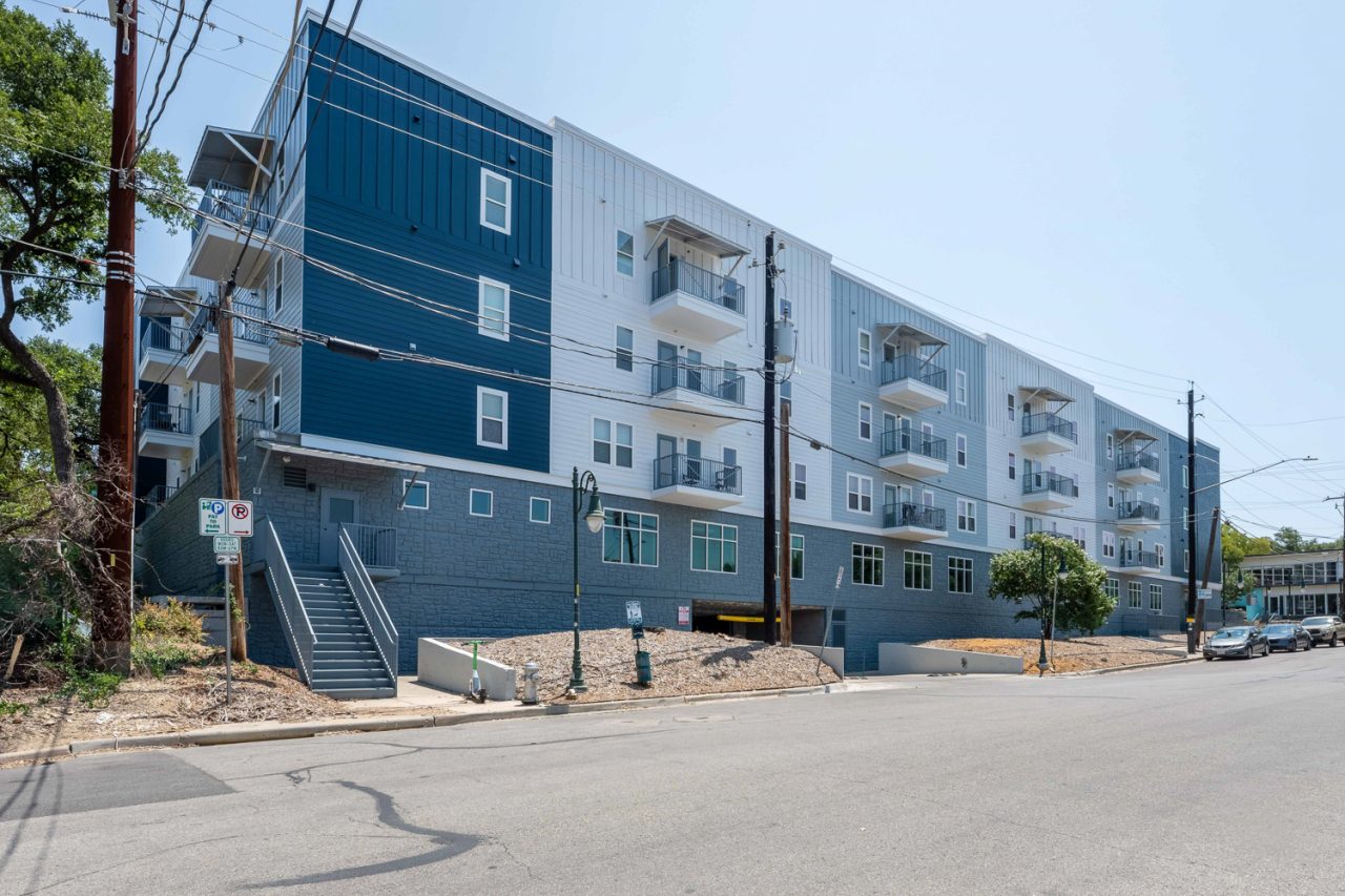 24-longview-apartments-near-ut-austin-community-building-exterior-parking-deck-entrance